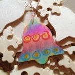 Wooden ornaments colored with tissue paper