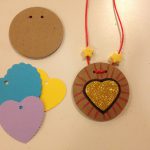 Necklaces with cardboard circles and paper hearts